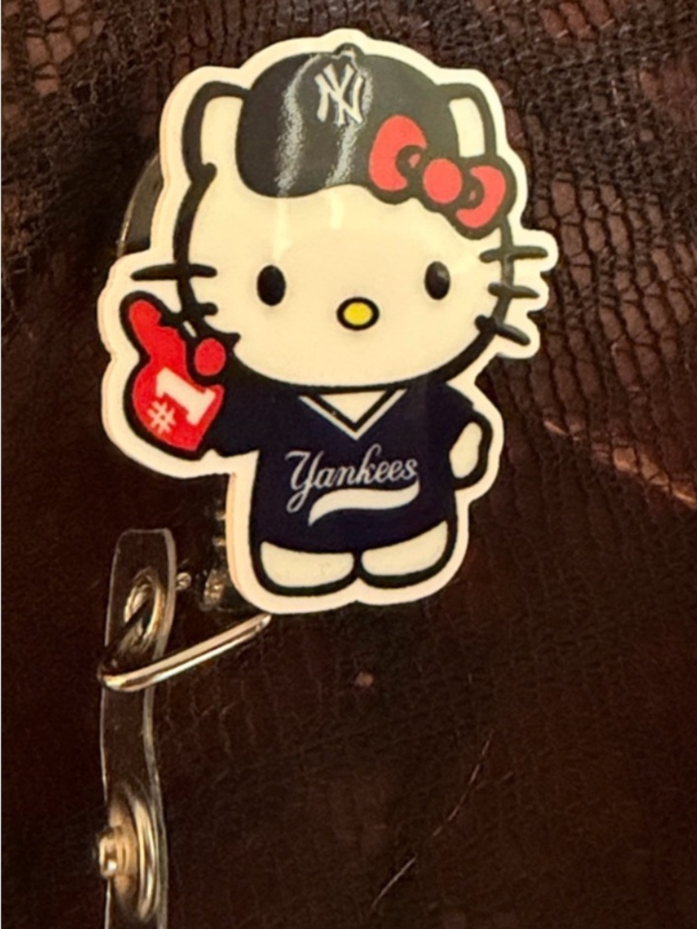 Hello Kitty New York yankees badge reel
- White, Navy, Red